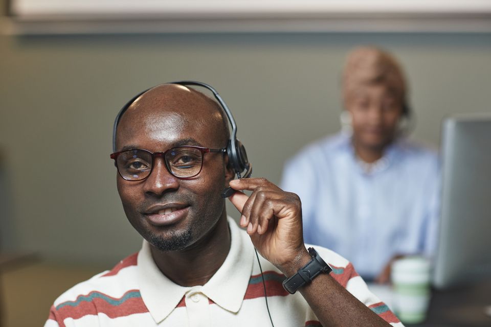 Pharmacist consulting with a patient in community pharmacy